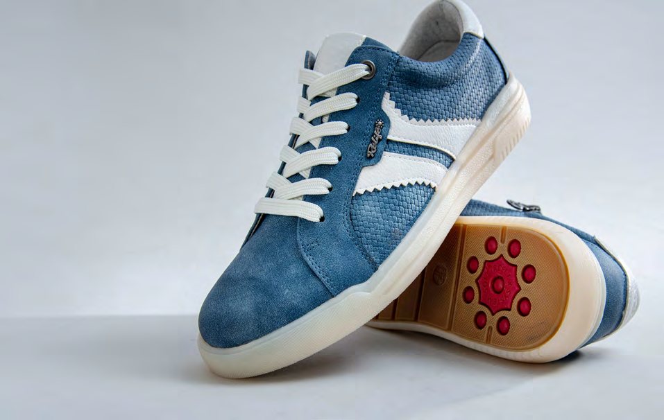 Blue Relife sneakers showing the red sole pattern