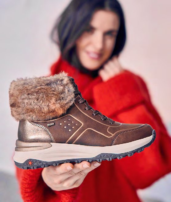 A woman holding a fur-lined Relife boot